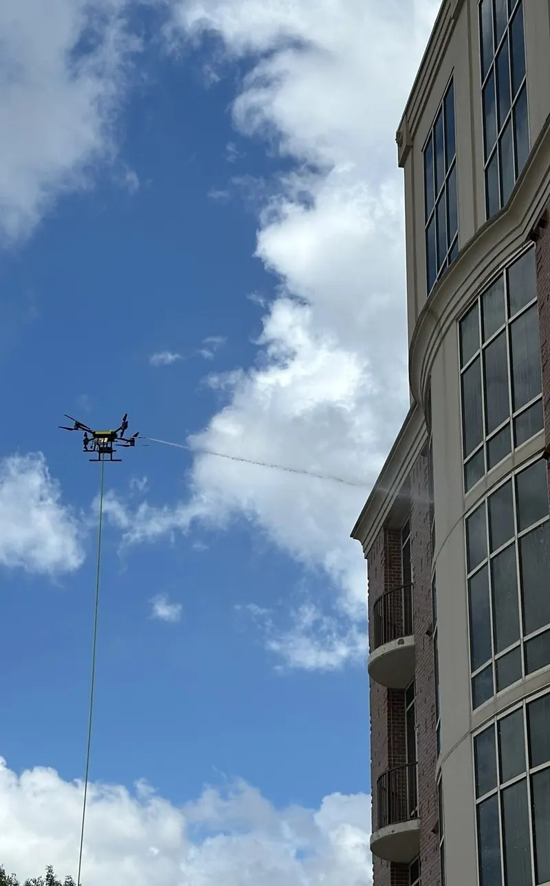 Drone beside the Tanglewood Condominium tower in Houston
