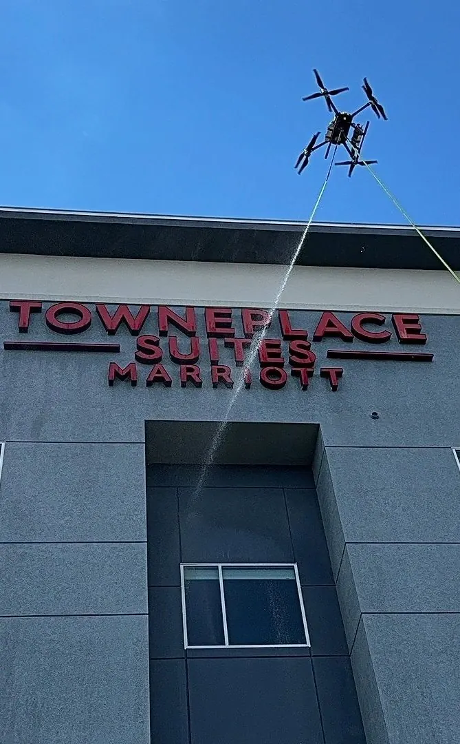 Drone washing the facade of a TownePlace Suites Marriott hotel
