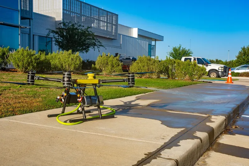 A FlyWash drone ready on the sidewalk